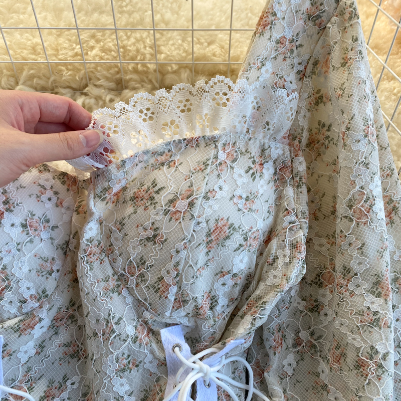 Sleeveless Lace Top With Floral Patterns And Side Ties